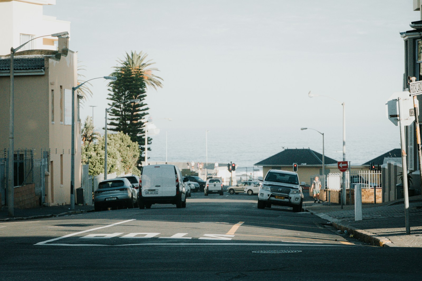 Photo by Karabo Mdluli a street filled with lots of traffic next to tall buildings